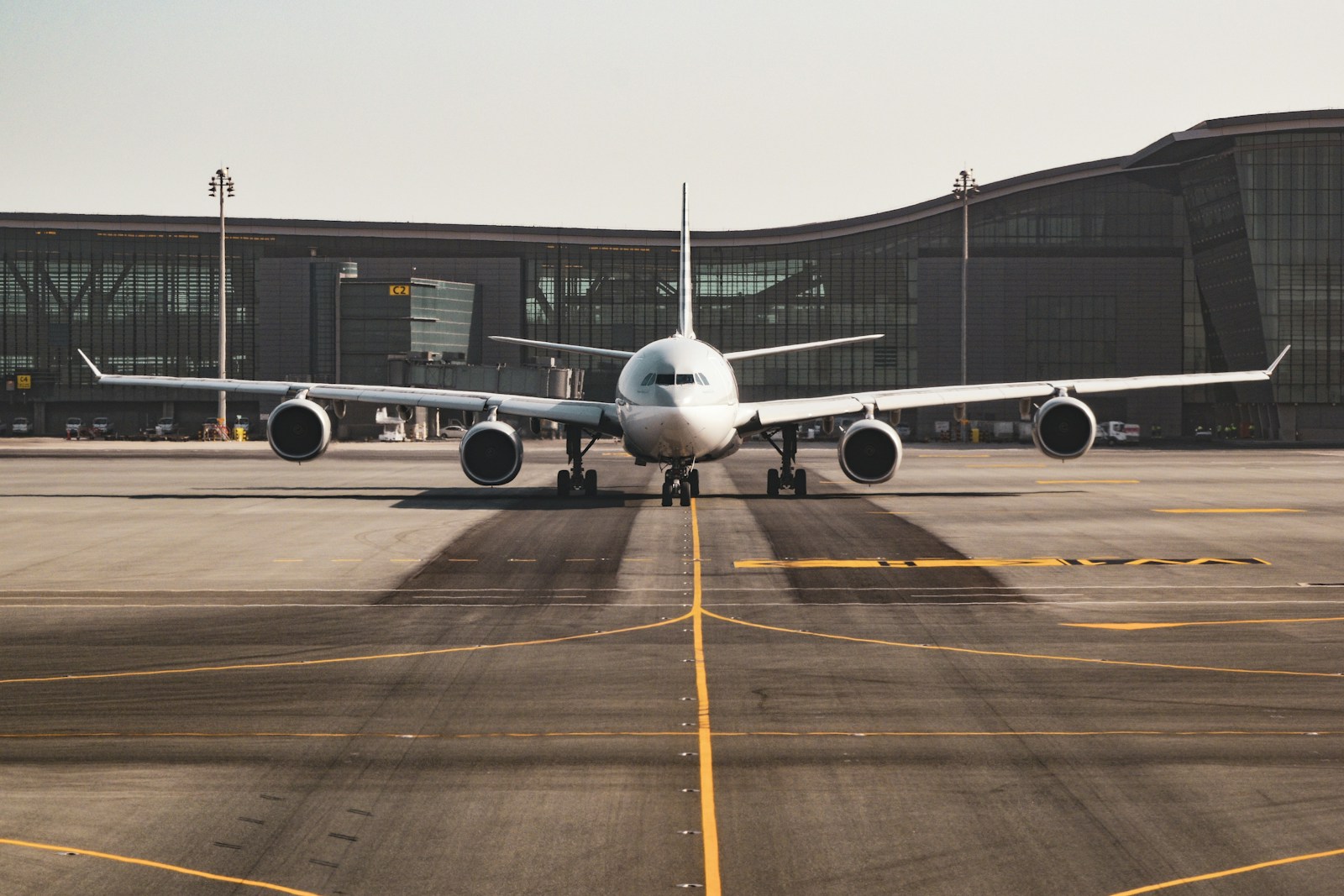 Wide-body aircraft on runway representing business travel booking flow
